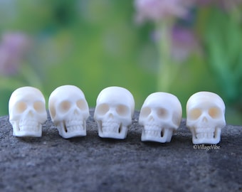 Hand Carved Bone Set of 2 Skull Sculpture