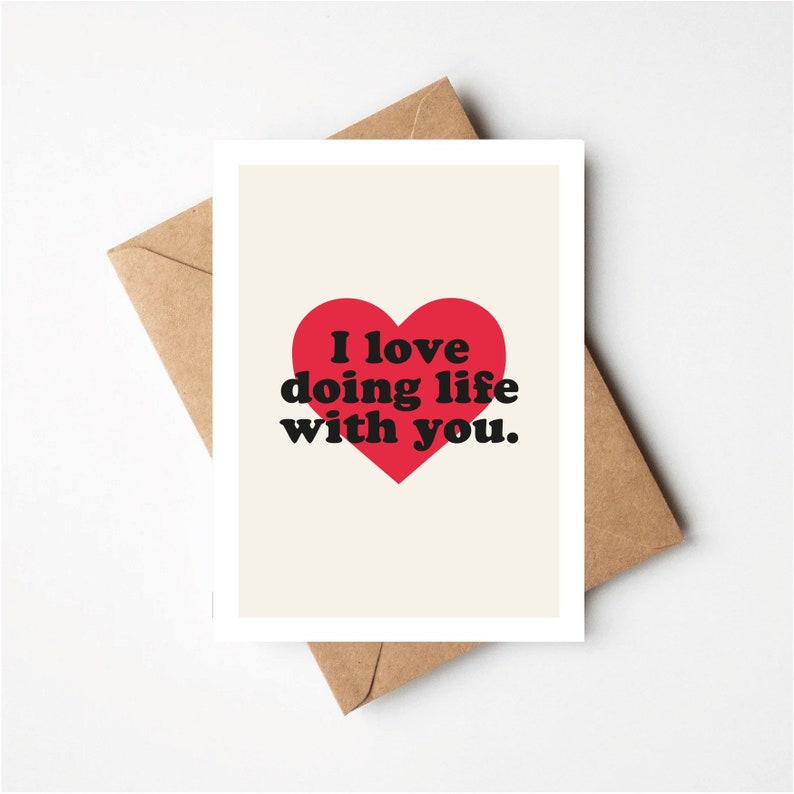 May include: A card with a red heart and the text "I love doing life with you."