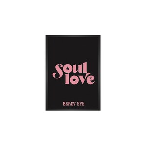 May include: A black and white framed print with the text "Soul Love" in pink lettering with two stars. The text "Beady Eye" is printed in white at the bottom of the print.