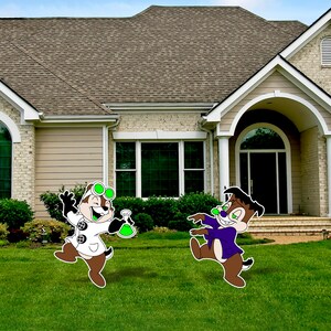 May include: Two cartoon chipmunk characters, one wearing a lab coat and goggles, the other wearing a purple vest, stand in a green grassy yard in front of a suburban home.