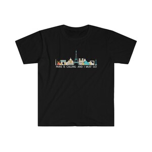 May include: Black t-shirt with a skyline of Paris landmarks and the text "Paris is calling and I must go."