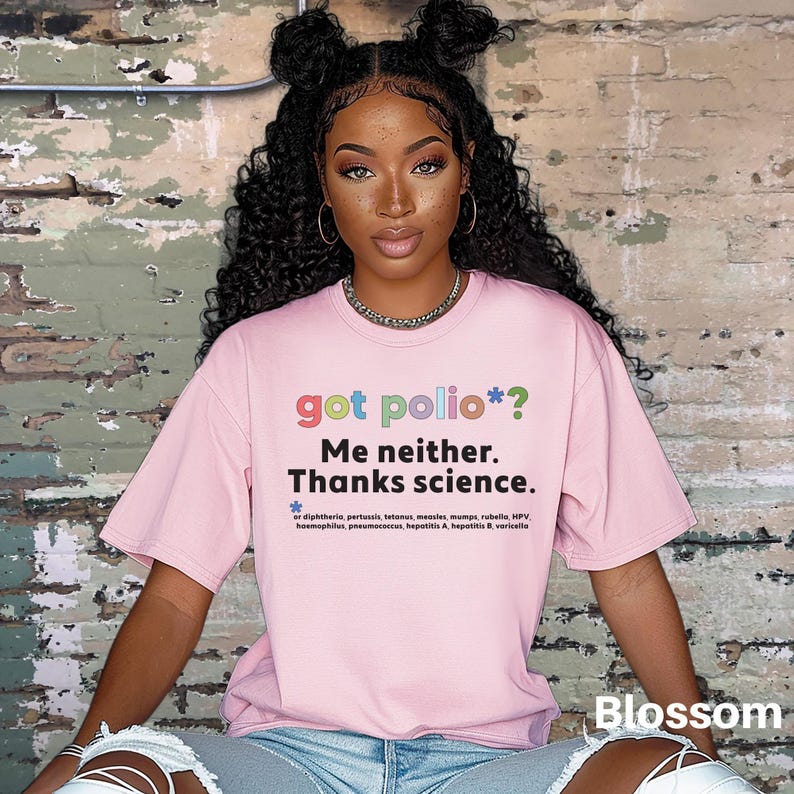 May include: A pink t-shirt with the text "got polio*? Me neither. Thanks science." in rainbow colors. The text is followed by a list of diseases, including diphtheria, pertussis, tetanus, measles, mumps, rubella, HPV, haemophilus, pneumococcus, hepatitis A, hepatitis B, and varicella.