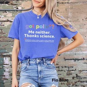 May include: A blue t-shirt with the text "got polio*? Me neither. Thanks science." in rainbow colors. The text is followed by a list of diseases in smaller font.