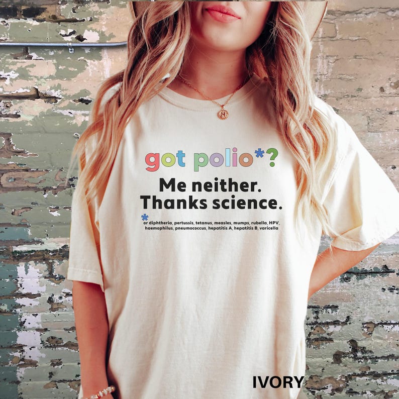 May include: A white t-shirt with the text "got polio*? Me neither. Thanks science." printed in rainbow colors. The text is followed by a list of diseases that vaccines protect against.