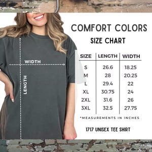 May include: Size chart for a unisex t-shirt, showing measurements in inches for sizes S, M, L, XL, 2XL, and 3XL. The chart shows the length and width of each size.