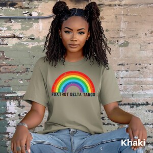 May include: A khaki t-shirt with a rainbow graphic and the text "FOXTROT DELTA TANGO".