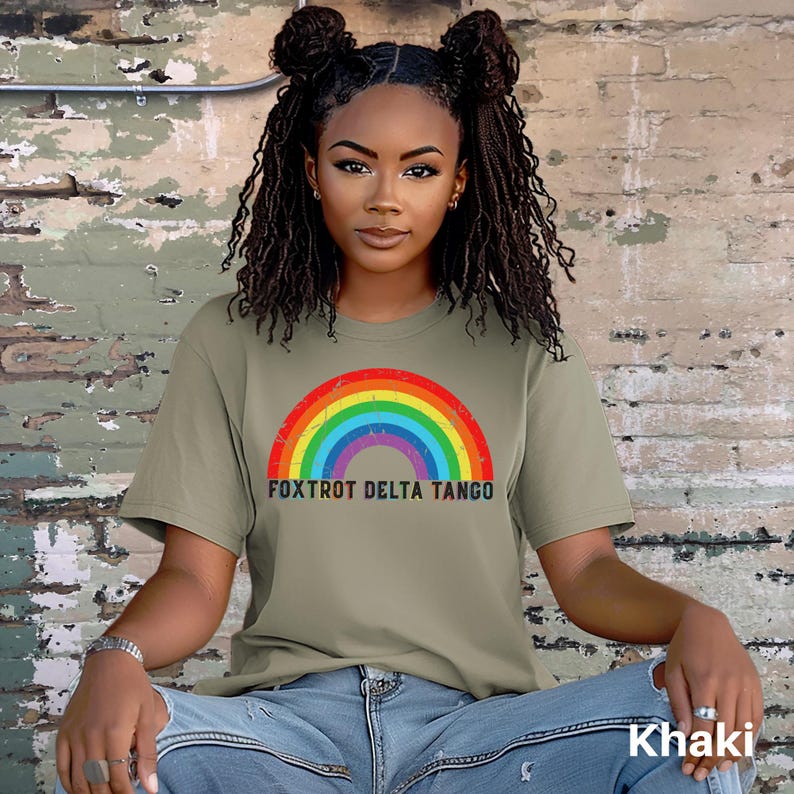 May include: A khaki t-shirt with a rainbow graphic and the text "FOXTROT DELTA TANGO".
