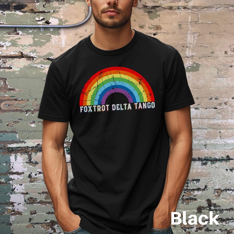 May include: A black t-shirt with a rainbow graphic and the text "FOXTROT DELTA TANGO" in white.