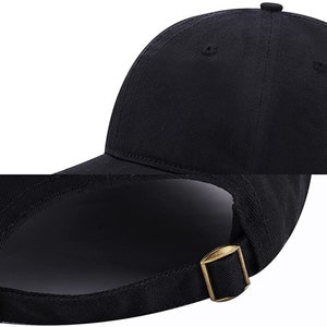 May include: A black baseball cap with a curved brim and an adjustable buckle closure.