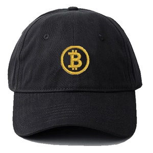 May include: A black baseball cap with a gold embroidered Bitcoin symbol on the front.