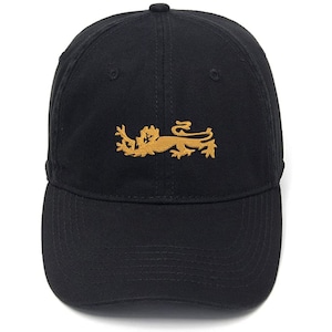 May include: Black baseball cap featuring a gold embroidered lion emblem. The cap has a curved peak and a fabric-covered button. A classic, casual accessory for everyday wear.