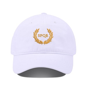 May include: White baseball cap with a gold embroidered laurel wreath and the text "SPQR" in the center.