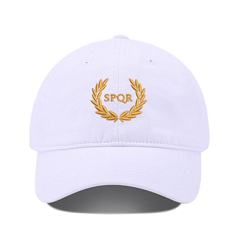 May include: White baseball cap with a gold embroidered laurel wreath and the text "SPQR" in the center.