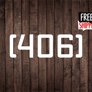 Peut inclure: Texte blanc sur un fond de bois brun qui lit [406].