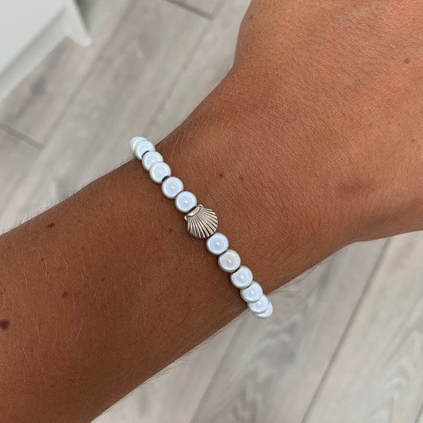 White miracle bead bracelet with shell charm