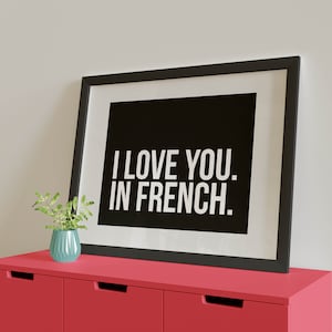 Black with white text, I Love You. In French 50 x 70cm Landscape