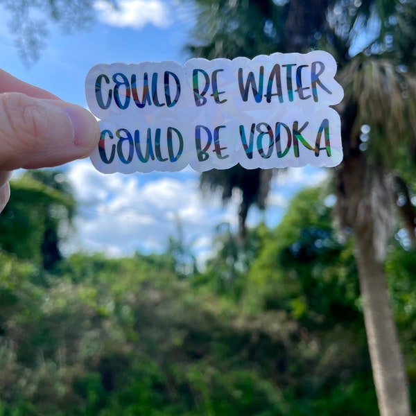 Could be water, could be vodka  waterproof,  vinyl holographic sticker