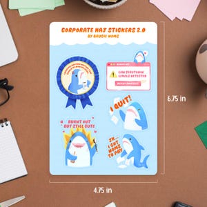 May include: A sticker sheet with shark illustrations and humorous text. The stickers include phrases like "I Quit!" and "Burnt Out But Still Cute." The sheet measures 12.07 cm x 17.15 cm.