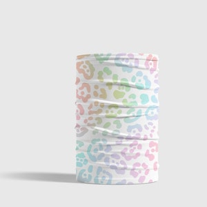 May include: A white face mask with a rainbow leopard print pattern.