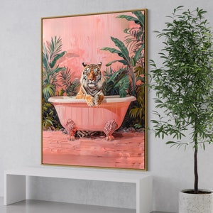 May include: A tiger sits in a pink bathtub with a tropical plant background. The tiger is looking directly at the viewer. The bathtub has ornate feet.