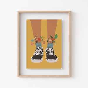 May include: A pair of black canvas trainers with white soles and laces. Flowers are growing out of the tops of the trainers.