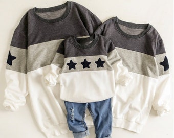 mom dad and newborn matching outfits