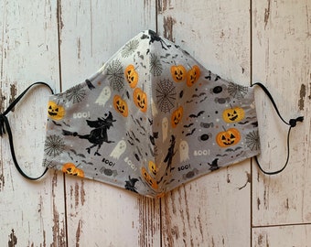 Halloween pumpkin/witch face mask. Double cotton layer with filter pocket and adjustable elastic ear loops.