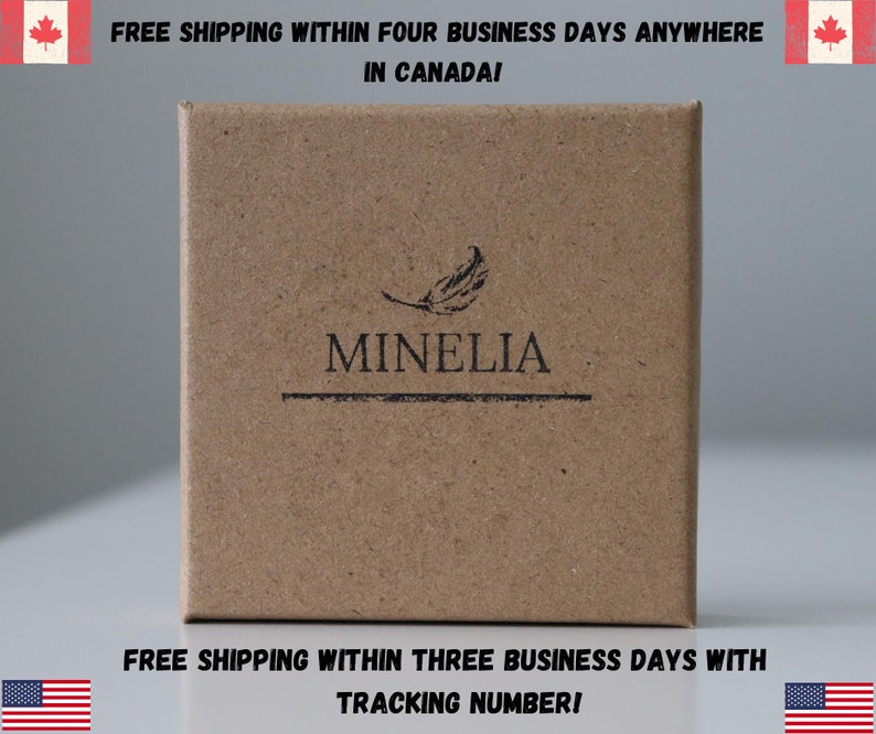 May include: A brown cardboard box with the text "MINELIA" printed on it. The box has a feather design and the text "FREE SHIPPING WITHIN FOUR BUSINESS DAYS ANYWHERE IN CANADA!" printed on the top. The bottom of the box has the text "FREE SHIPPING WITHIN THREE BUSINESS DAYS WITH TRACKING NUMBER!" printed on it.