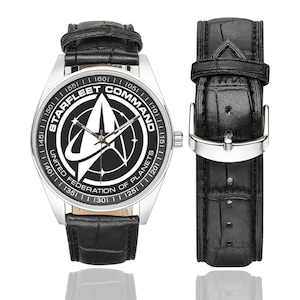 Close up of Starfleet Command logo on Star Trek watch face.
