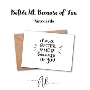 May include: A white notecard with the text "I'm a BETTER ME because OF YOU" in black script, with a brown envelope behind it. The words "Better ME Because of You" and "Notecards" are above the card.