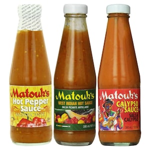 May include: Three glass bottles of Matouk's hot sauce. The bottles are labeled "Hot Pepper Sauce", "West Indian Hot Sauce", and "Calypso Sauce". Each bottle contains 300 ml (10 fl oz) of sauce.