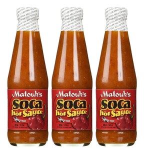 May include: Three glass bottles of Matouk's Soca hot sauce. The bottles are filled with a bright orange sauce and have a red label with the brand name and product name. The label also features a red pepper.