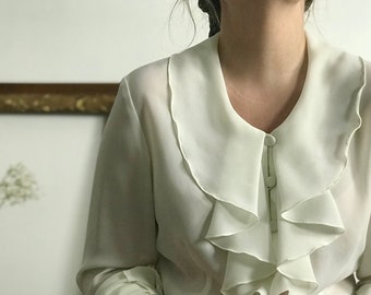 Vintage Poet Blouse with Ruffled Neckline and Button-up Closure