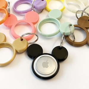 Portachiavi Mickey AirTag Holder. Disponibili opzioni di cambio colore con temperatura e raggi UV!