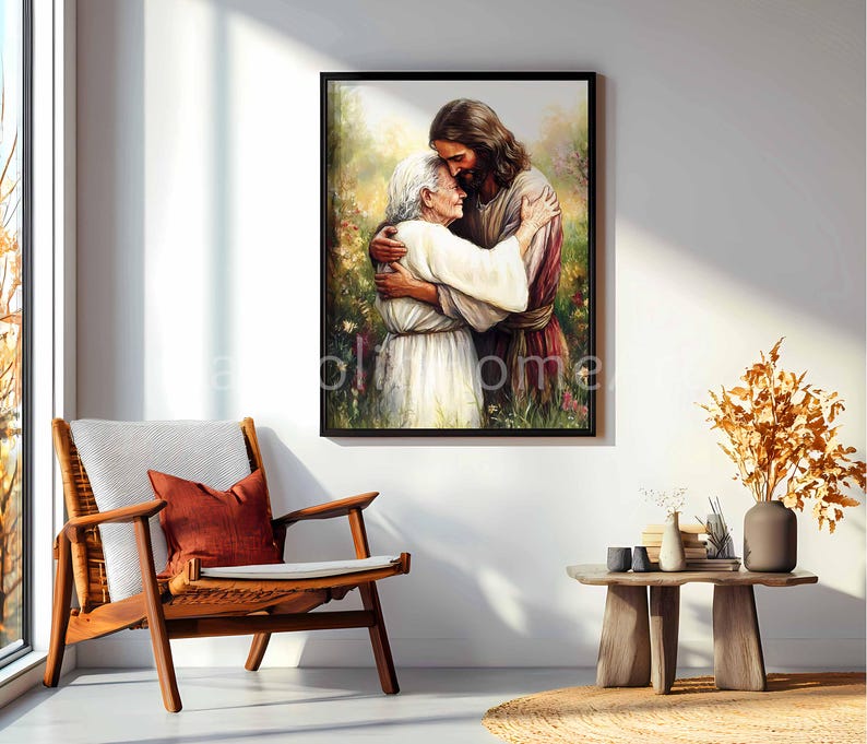 May include: A framed print depicts a tender embrace between two figures, one with long hair and a robe, the other in a white dress. The artwork is set against a backdrop of soft, blurred greenery and flowers, with a warm, inviting light.