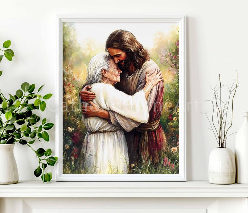 May include: A framed print depicts a tender embrace between two figures. One figure, with long brown hair and a maroon robe, embraces an elderly person in a white garment. The background features a lush garden with colorful flowers, creating a serene and comforting scene.