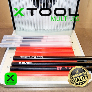 May include: A close-up of a black and red multi-jig tool with the text "XTOOL MULTIJIG" and "BORA More than cooking."  The tool has a red rubber mat with a black rubber mat underneath. The tool also has a premium quality sticker with a tick.