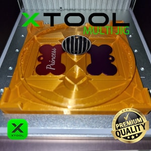 May include: A gold-coloured XTOOL Multi Jig with a red and purple dog bone-shaped tag. The red tag has the word "Princess" in white script. A black and silver oval tag is in the centre. The image also includes the XTOOL logo and a "Premium Quality" seal.