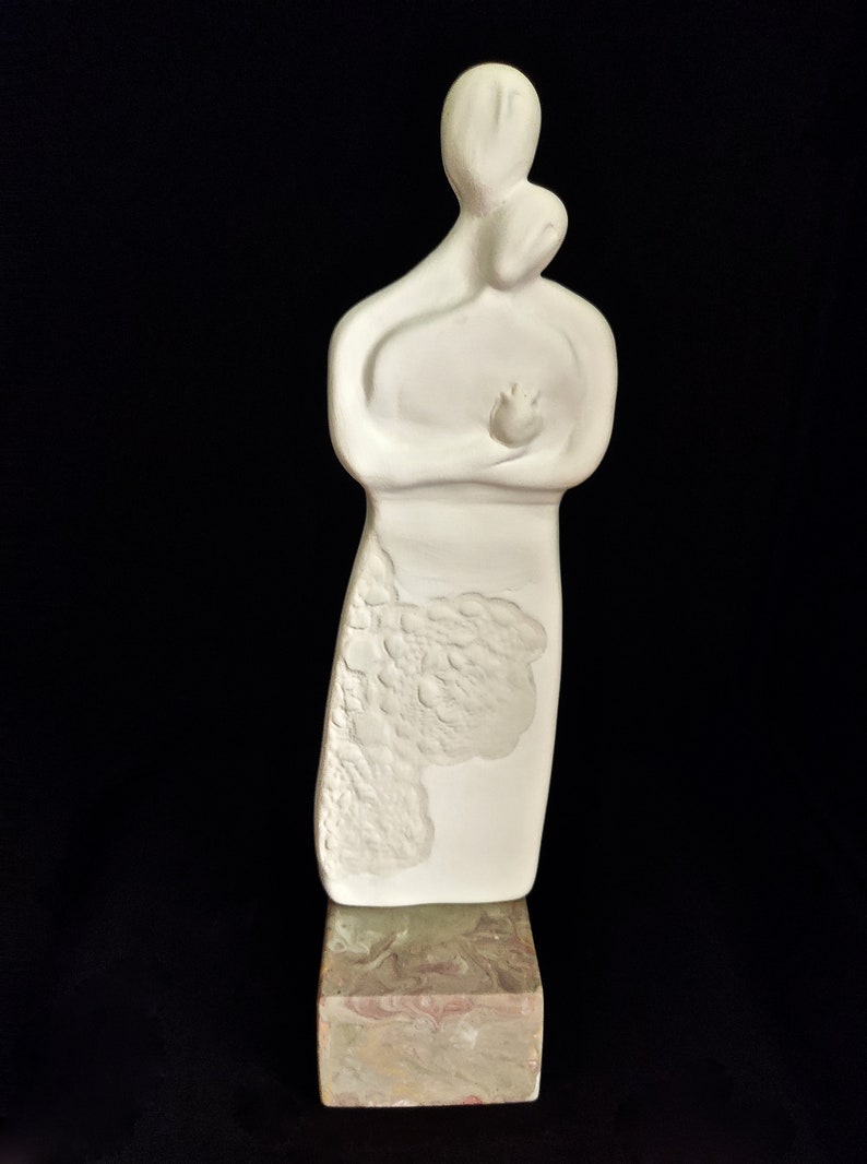 hand made ceramic sculpture of a couple holding each other in love Cycladic idol