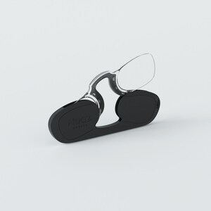 May include: Black reading glasses with a clear frame and a black case. The case has the text "Algooz Optics" printed on it.