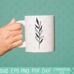 May include: A white ceramic mug with a black line drawing of a leafy branch on the side.