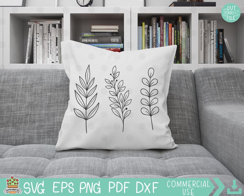 May include: A white throw pillow with three black line drawings of stylized leaves. The leaves are arranged vertically in a row in the center of the pillow.