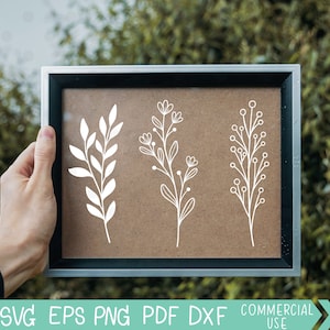 May include: Three white line drawings of different floral sprigs on a brown background. The sprigs are simple and delicate, with small leaves and flowers.