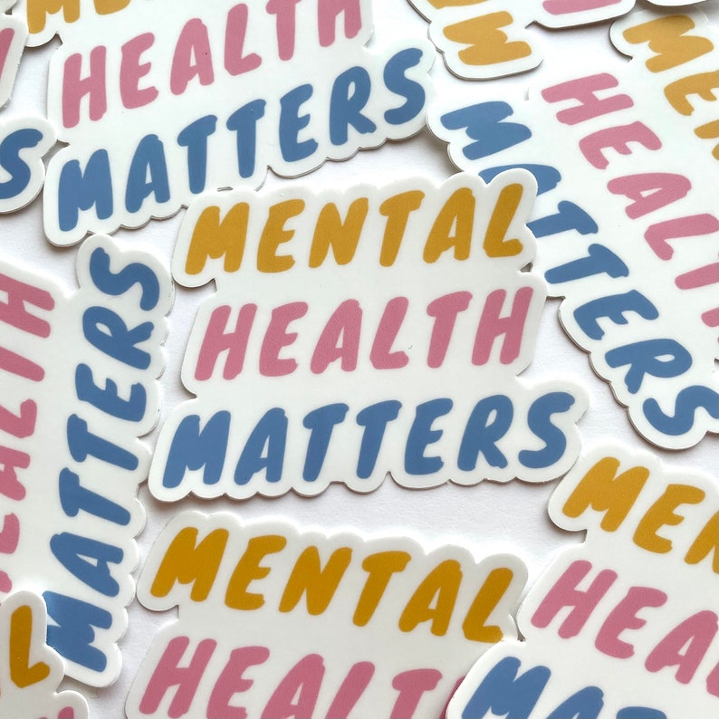 May include: Multiple colorful stickers with the text "Mental Health Matters" in pink, blue, and yellow. The stickers are on a white background.