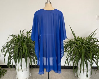 May include: A royal blue sheer cover-up with a loose, flowing fit. The cover-up is made of a lightweight fabric and has a simple, elegant design.