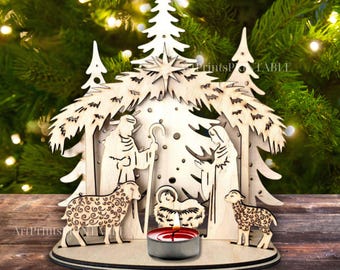 May include: A wooden Christmas nativity scene with a candle. The scene includes figures of Mary, Joseph, baby Jesus, and two sheep. The backdrop features a star and pine trees, all cut from wood.
