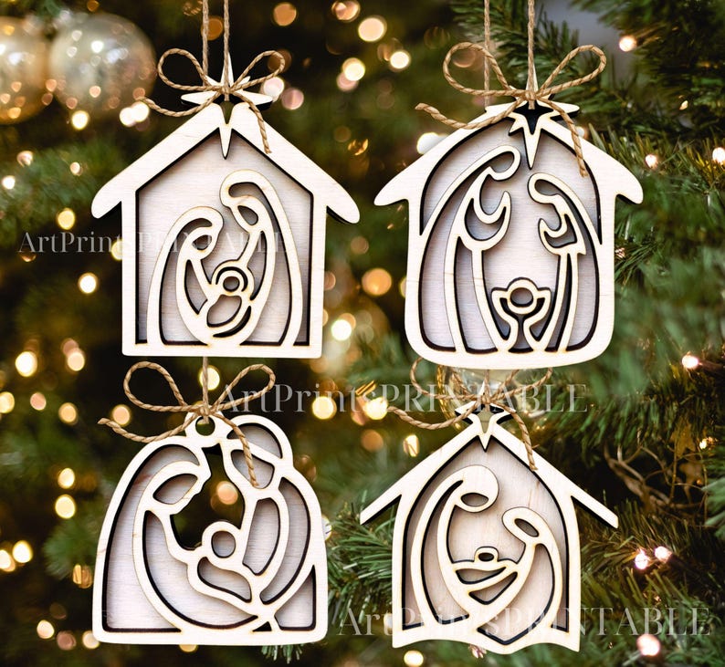 May include: Four wooden Christmas ornaments with a nativity scene design. Each ornament is a house shape with a cutout of Mary, Joseph, and baby Jesus. They are strung with twine and have a star at the top.