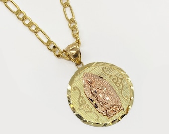 May include: A gold chain necklace with a round pendant featuring a detailed image of the Virgin Mary. The pendant is two-toned, with a gold outer rim and a rose gold center.