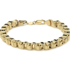 Könnte beinhalten: Ein goldenes Armband mit einem geflochtenen Kettendesign. Das Armband hat einen Karabinerverschluss.