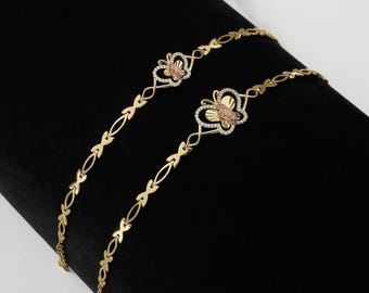 Pulsera elegante bicolor con mariposa y la Virgen María en oro de 10k y 14k